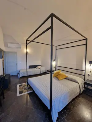 Letto o letti in una camera di B&B L'Orto Sul Tetto