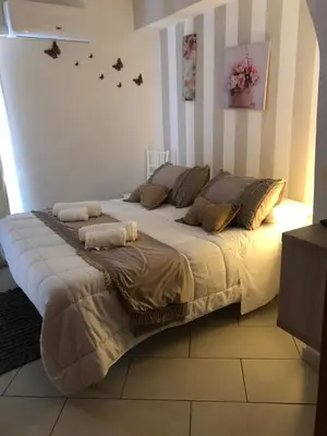 Letto o letti in una camera di Nicaredda Guest Rooms