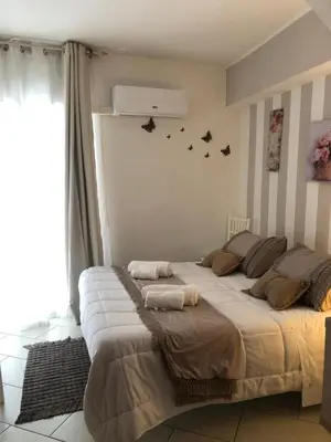 Letto o letti in una camera di Nicaredda Guest Rooms
