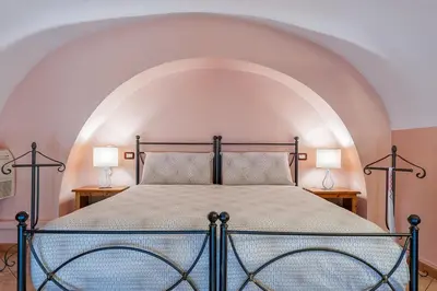 Letto o letti in una camera di Case Vacanze Catania