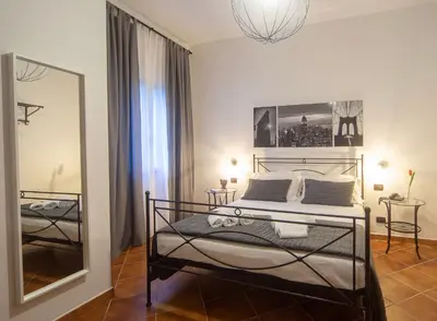 Letto o letti in una camera di Holiday Rooms Portale Pirrera