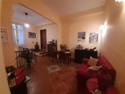 Area soggiorno di Holiday Rooms Portale Pirrera