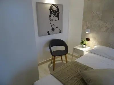 Letto o letti in una camera di Holiday Rooms Portale Pirrera