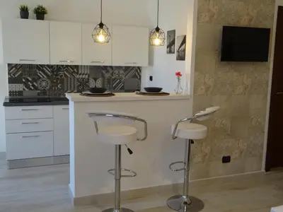 Cucina o angolo cottura di Holiday Rooms Portale Pirrera