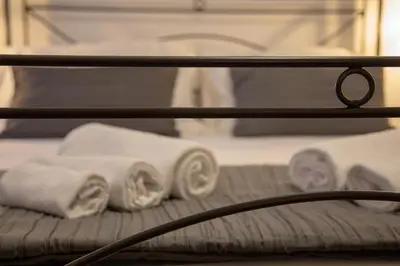 Letto o letti in una camera di Holiday Rooms Portale Pirrera