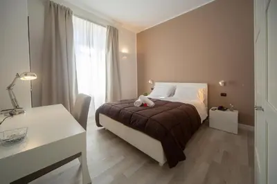 Letto o letti in una camera di Holiday Rooms Portale Pirrera