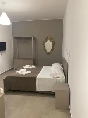 Letto o letti in una camera di AEROPORTO KATANÈ ROOMS