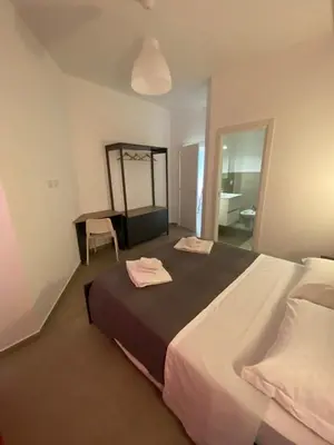 Letto o letti in una camera di AEROPORTO KATANÈ ROOMS