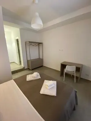 Letto o letti in una camera di AEROPORTO KATANÈ ROOMS