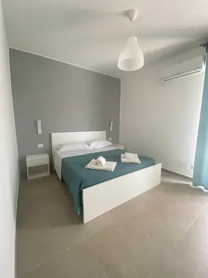 Letto o letti in una camera di AEROPORTO KATANÈ ROOMS