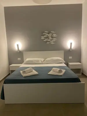 Letto o letti in una camera di AEROPORTO KATANÈ ROOMS