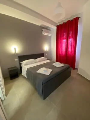 Letto o letti in una camera di AEROPORTO KATANÈ ROOMS