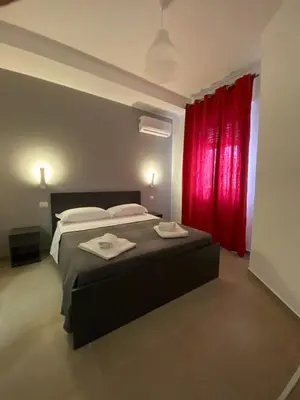 Letto o letti in una camera di AEROPORTO KATANÈ ROOMS