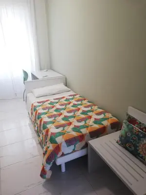 Letto o letti in una camera di Casa Tevere
