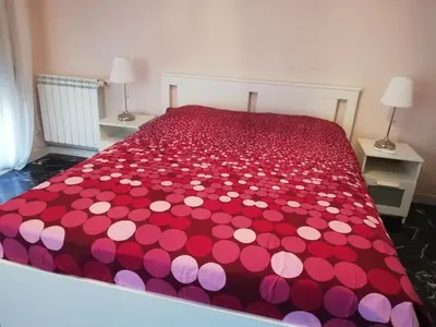 Letto o letti in una camera di Casa Tevere