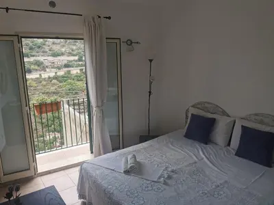 Letto o letti in una camera di Balcone Barocco.