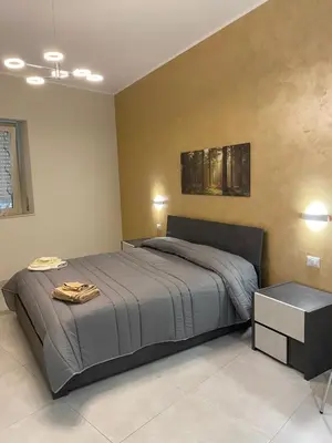 Letto o letti in una camera di B&B San Giuseppe, nel cuore di Ortigia