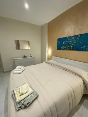 Letto o letti in una camera di B&B San Giuseppe, nel cuore di Ortigia