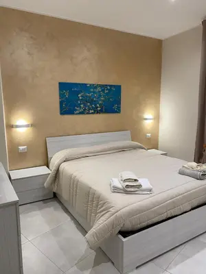 Letto o letti in una camera di B&B San Giuseppe, nel cuore di Ortigia