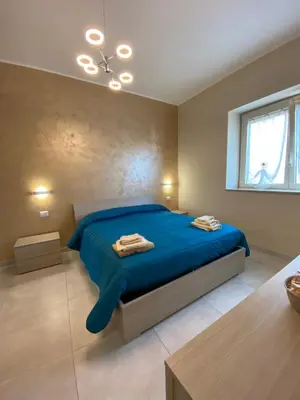 Letto o letti in una camera di B&B San Giuseppe, nel cuore di Ortigia