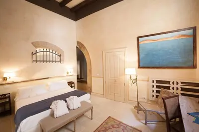 Letto o letti in una camera di Algilà Ortigia Charme Hotel
