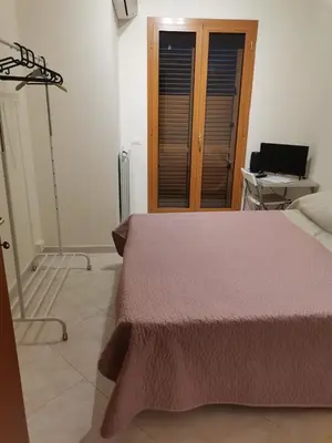 Letto o letti in una camera di Appartamento Sapienza