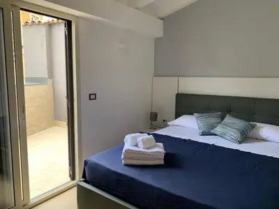 Letto o letti in una camera di Elegance