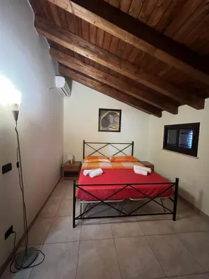 Letto o letti in una camera di Casa Arianna