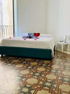 Letto o letti in una camera di Casa di Rita