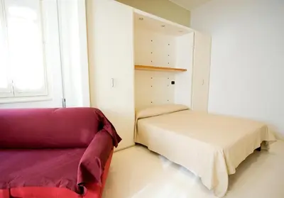 Letto o letti in una camera di Residence Arco Antico