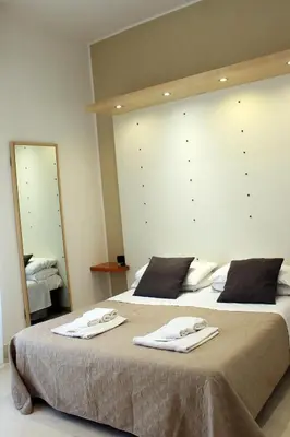 Letto o letti in una camera di Residence Arco Antico