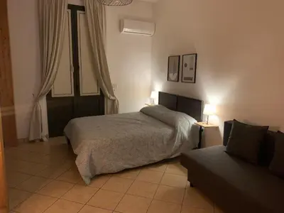 Letto o letti in una camera di Teatro Greco Suite