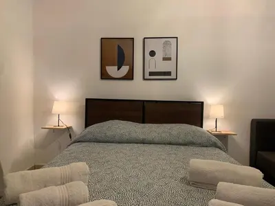 Letto o letti in una camera di Teatro Greco Suite