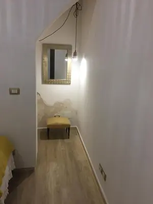 Area soggiorno di IL NIDO DI ARETUSA apt by Addler House Ospitality