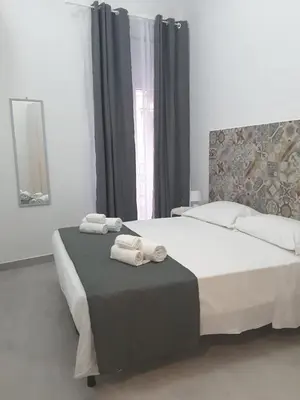 Letto o letti in una camera di A casa dei 3