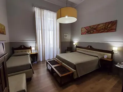 Letto o letti in una camera di La Collegiata Guest House