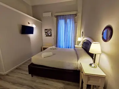 Letto o letti in una camera di La Collegiata Guest House