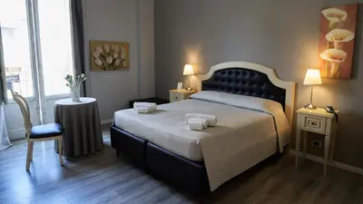 Letto o letti in una camera di La Collegiata Guest House