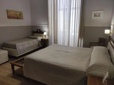 Letto o letti in una camera di La Collegiata Guest House