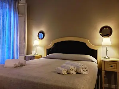 Letto o letti in una camera di La Collegiata Guest House