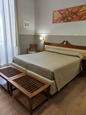 Letto o letti in una camera di La Collegiata Guest House