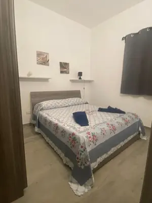 Letto o letti in una camera di Casa Malù