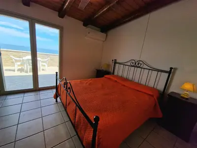 Letto o letti in una camera di Villa Daniela - Villa con piscina privata e discesa a mare tra Catania e Siracusa