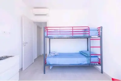 Letto o letti in una camera di Casa vacanza Marietta