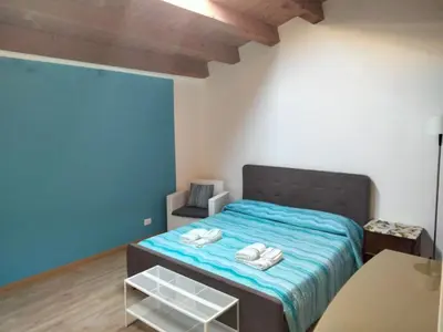 Letto o letti in una camera di Casa Smile