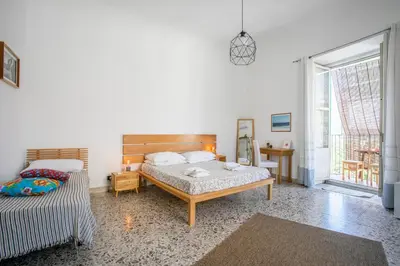 Letto o letti in una camera di Casa Maravì