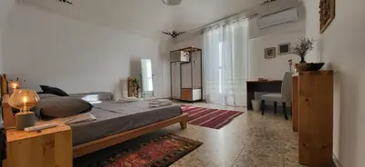 Letto o letti in una camera di Casa Maravì