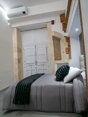 Letto o letti in una camera di VaKKia - Ortigia Holiday Home