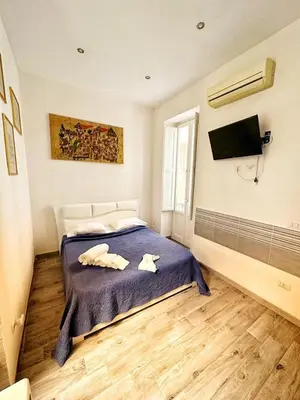 Letto o letti in una camera di Residenza Dione 1