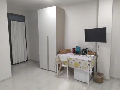 TV o dispositivi per l'intrattenimento presso Shine Flowers Room